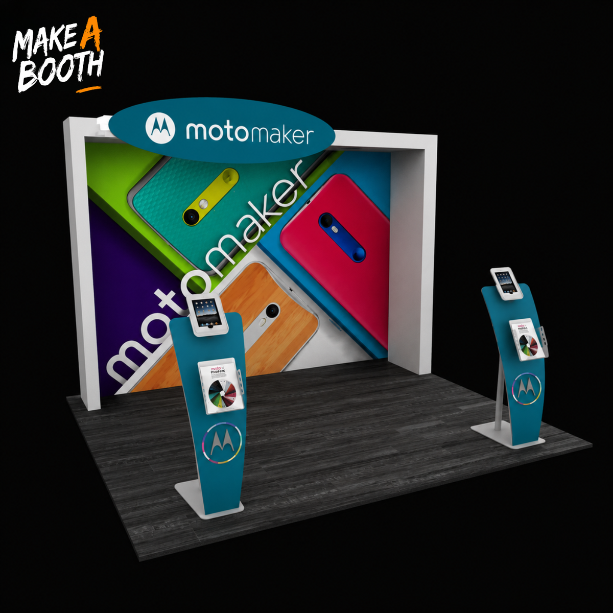 Backlit exhibit booth with white frame, motomaker graphic, and two teal display towers
