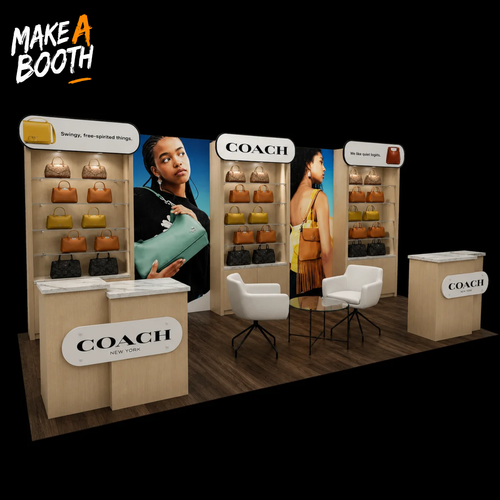 Modular backlit exhibit booth with COACH counters, chairs, and illuminated display panels