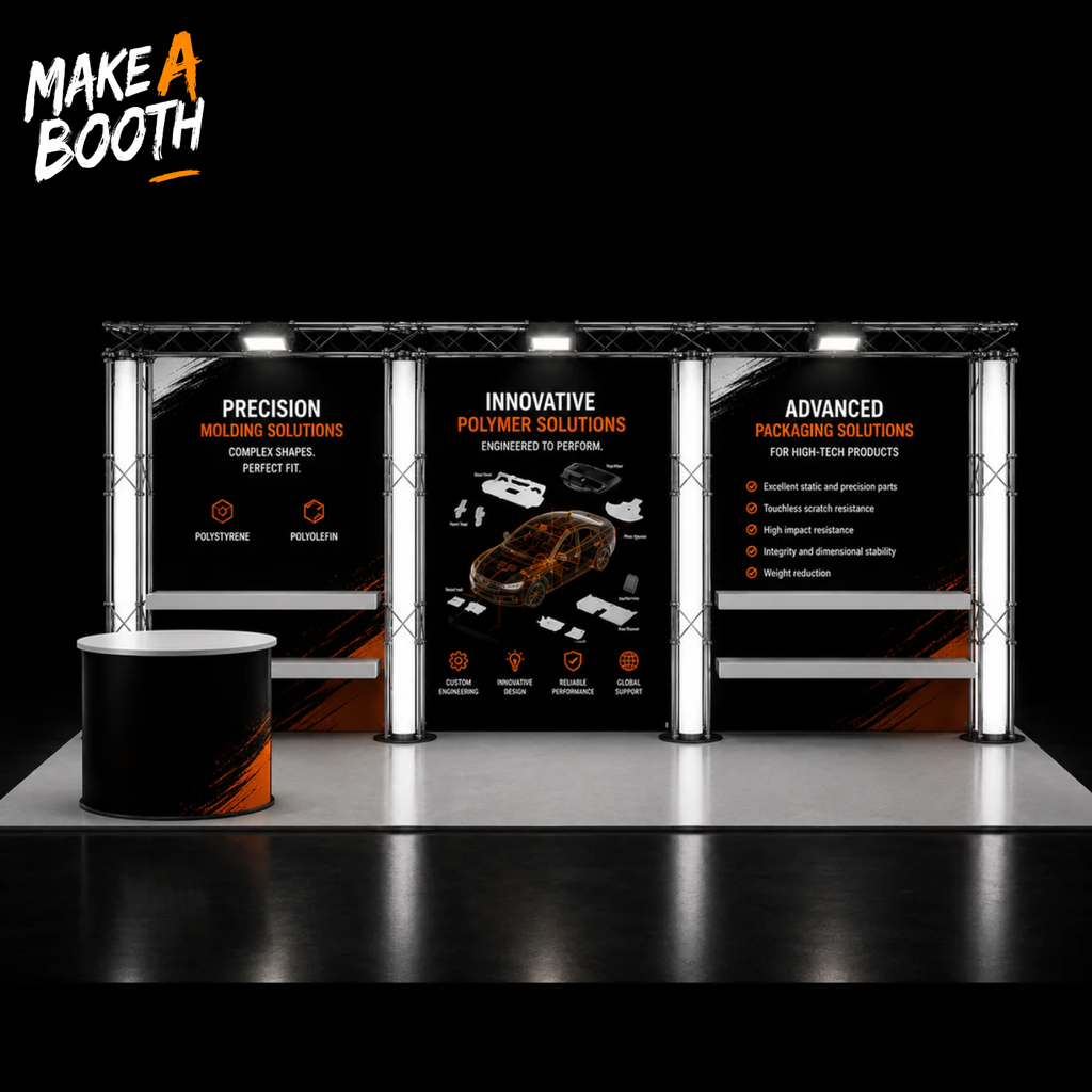Modular trade show booth with black banner panels, silver truss frame, and display counter