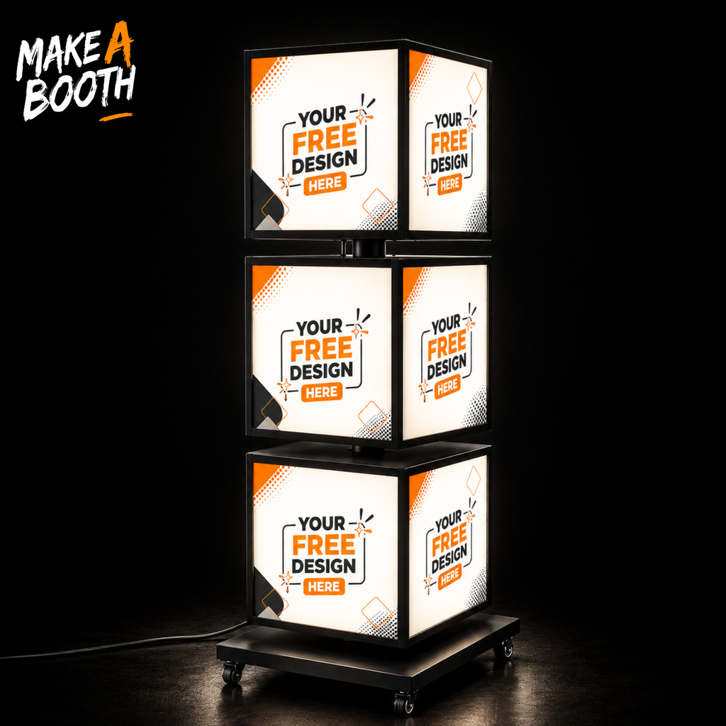 Freestanding rotating LED light box tower with four illuminated cube faces on a stand