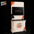 Portable fabric display table with black monitor screen shelf and front design graphic