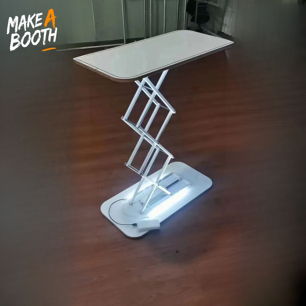 LED-lit tension fabric counter with white top and X-frame base