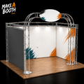 U-shaped exhibition booth with silver metal frame, wood platform, and white graphic panels